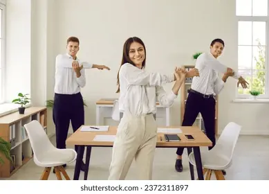 Office team participating in a group stretching session